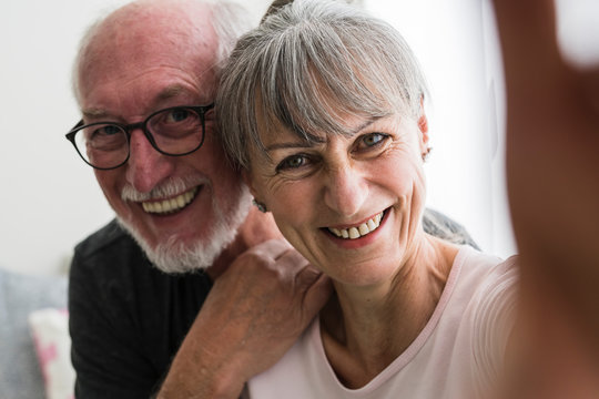 Cool elderly couple taking a selfie