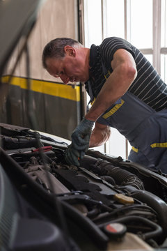 Mechanic at work in a repair car shop