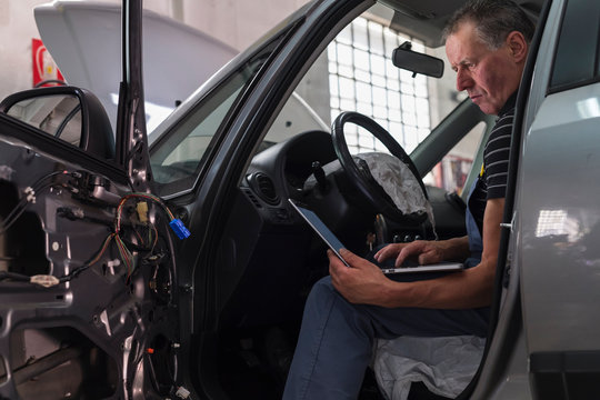 Mechanic at work in a repair car shop