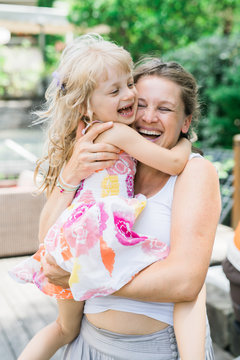 Happy mother with little girl