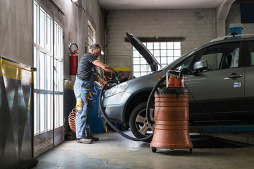 Mechanic at work in a repair car shop