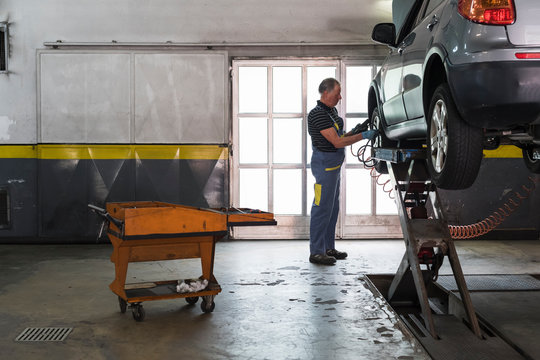 Mechanic at work in a repair car shop