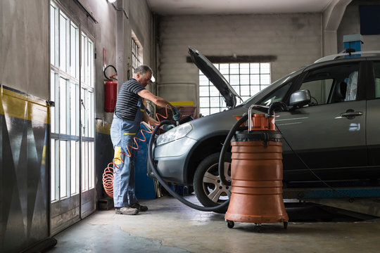 Mechanic at work in a repair car shop