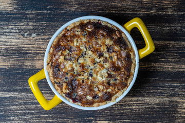 Homemade organic currant pie with walnut, dessert ready to eat. Currant tart on the old wooden background, closeup