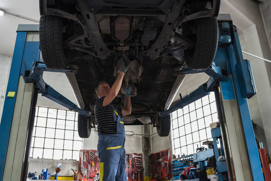Mechanic at work in a repair car shop