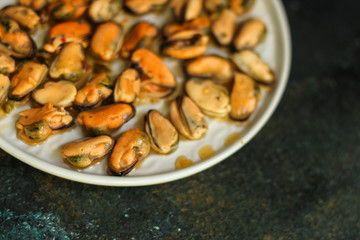 mussels in oil and spices (appetizer mollusks, pickled seafood, healthy food) menu concept. food background. copy space. Top view