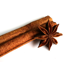 Cinnamon herbs and star anise, isolated on a white background.