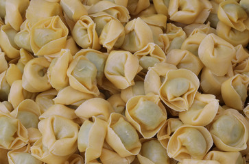 background of many italian pasta called Tortelli with spinach an