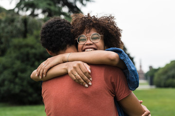 Happy young black couple in the park