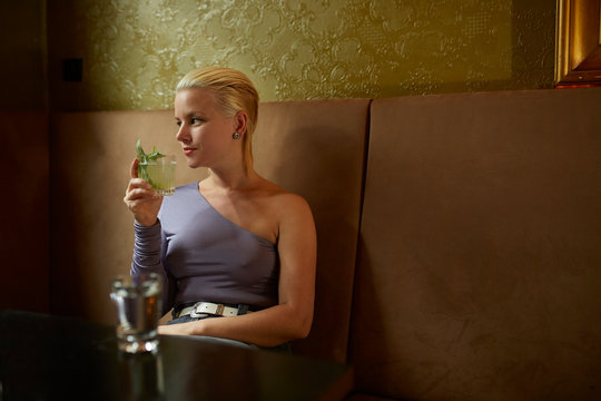 A Scandinavian lady having a cocktail.