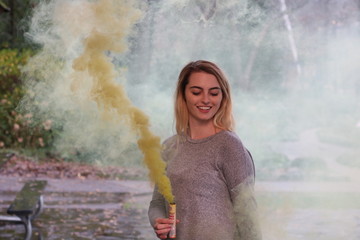 woman smoke bomb yellow