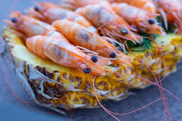 Boiled shrimp served in pineapple, close up