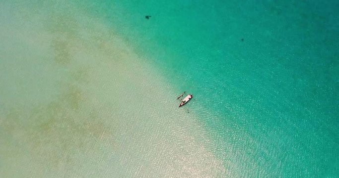 Top View of Tourists Swimming and a Canoe in the Crystal Clear Water, Bora Bora