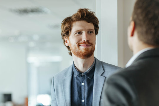 Co-Workers Talking at Work