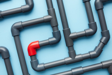 Singular red piece in system of gray pipes