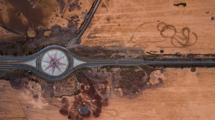 Road around beautiful symbol in dry countryside
