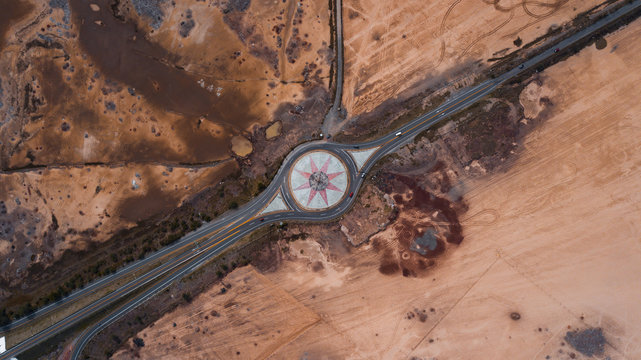 Road around beautiful symbol in dry countryside