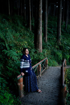 woman spending leisurely time on a forest trail