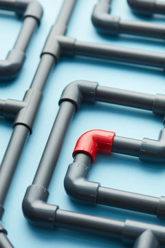 Distinctive red part in system of gray pipelines