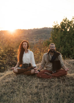 Couple Doing Yoga In Nature