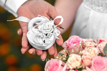 wedding bouquet and castle in the hands of the bride bride and groom