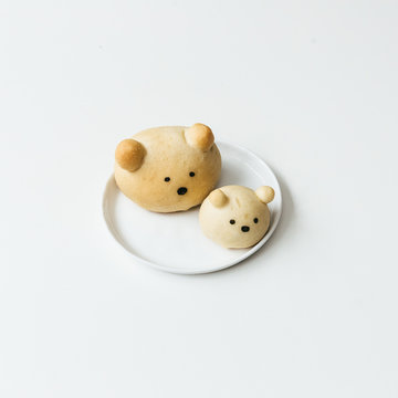 Homemade bear bread buns on ceramic plates ready to be served