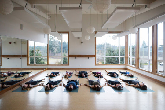 Group of yoga class in shavasana