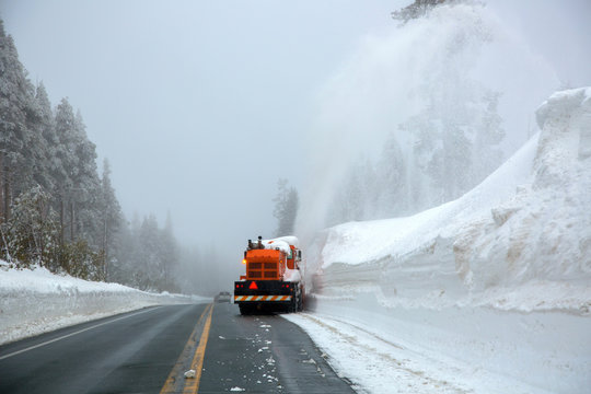 Vehicle clearing snow from the streets in the Sierras