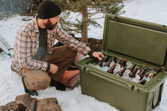 Man Grabbing Beer From Ice Chest Cooler