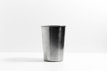 Close-up of steel cup isolated on white background.