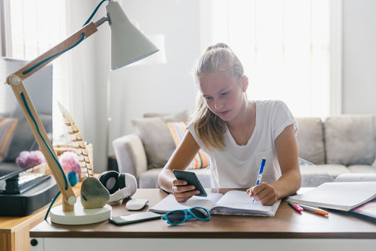 Student with Calculator doing Math Homework