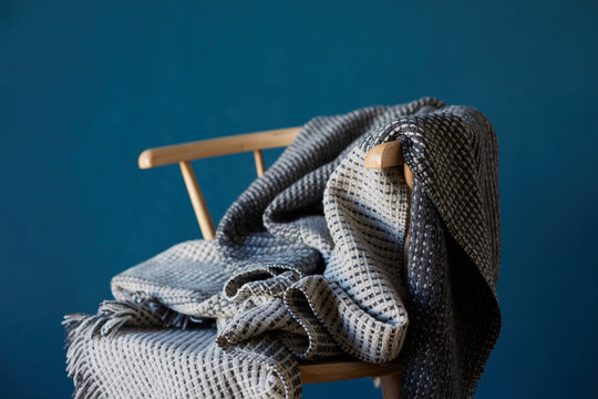 Seat and blanket with blue wall background