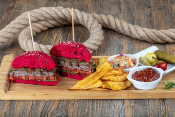 Red bread, burgers. American beefsteak burgers hamburgers pickles, ketchup, mayonnaise and fried...