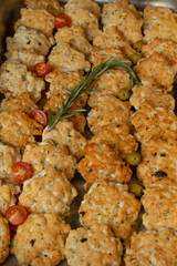 Homemade cutlets with tomatoes and green olives