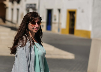 Fototapeta premium Smiling pretty girl stands on the street