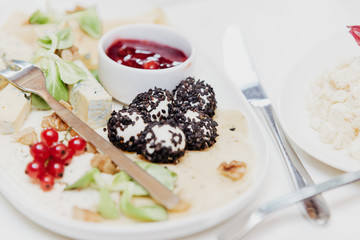 plate with various types of cheese,