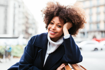 Mature afro hairstyle woman in the city.