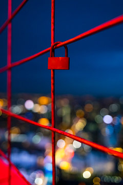 Love Sign. Close-Up Of Heart Shape Love Lock Hanging On a fence.