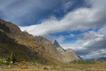Fototapeta premium Beautiful scenery from the Italian Alps with picturesque rivers and waterfalls, cliffs and magical mountain valleys