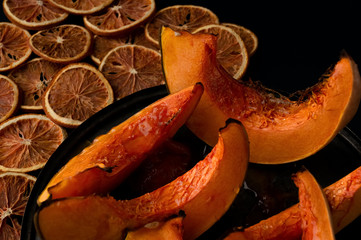 pumpkin baked in oven with oranges