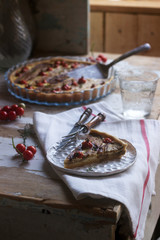 Pie stuffed with vegetables, cottage cheese and cream on a wooden background. Rustic style.