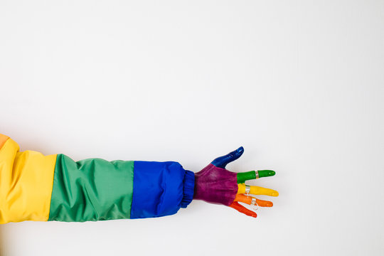 Crop female multicolored hand in rings