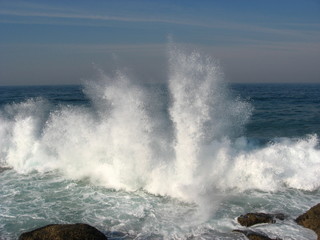 Large splash as wave hits rock on Natal coast.