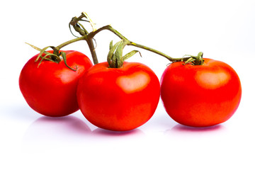 Bunch of fresh italian tomatoes . Isolated on white background.