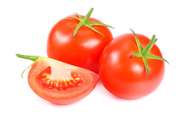 fresh tomatoes with slices isolated on white background.