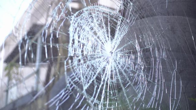 broken or cracked glass in defocus and of focus. camera movement.