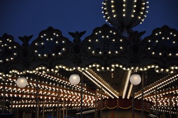 Christmas decorations on the roof of a children's carousel