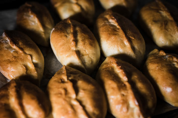 Toasted pies on parchment paper and everything on a tray