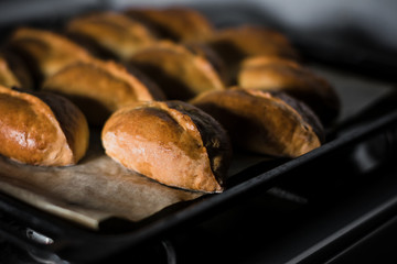Toasted pies on parchment paper and everything on a tray