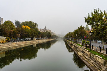 Panoramic view over Dambovita River in a foggy day in Bucharest, Romania, 2019